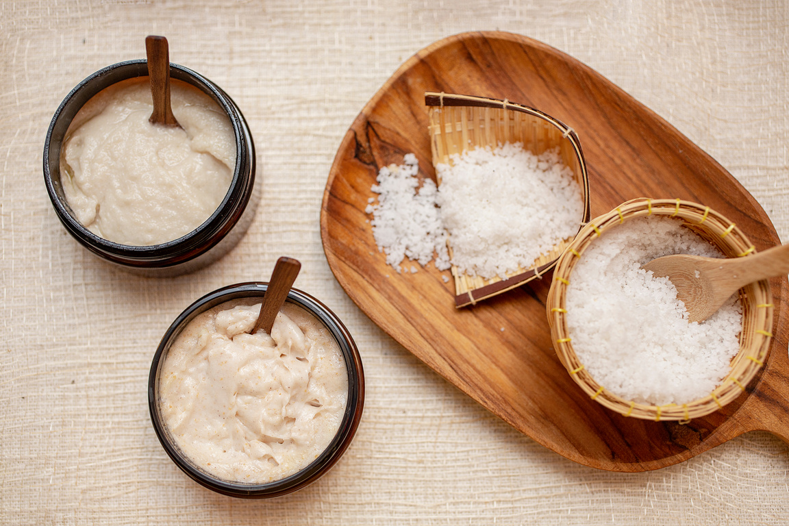 Spa Set. Handmade Salt Scrub And Cream Scrub With Coconut Oil. Scrub in bathroom. Thailand.