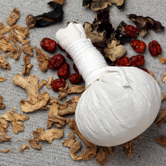 white cloth herbal compress ball